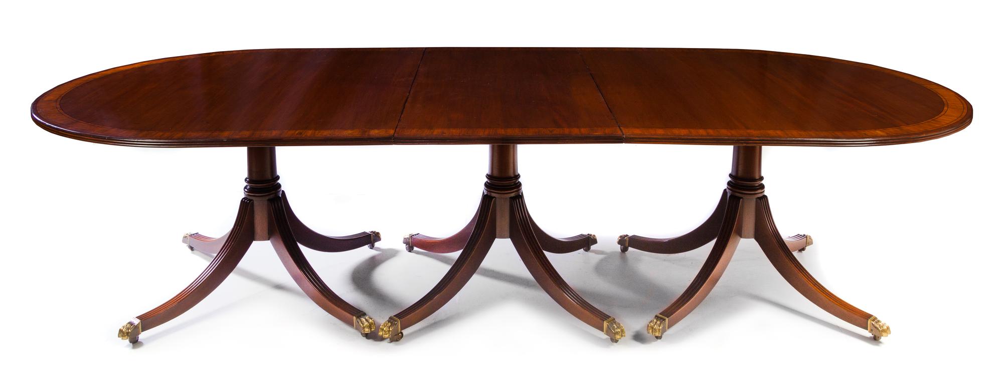 A Regency Style Mahogany Dining Table Height 29 1/2 x width 52 1/2 x length 142 inches (fully extended). — 20TH CENTURY