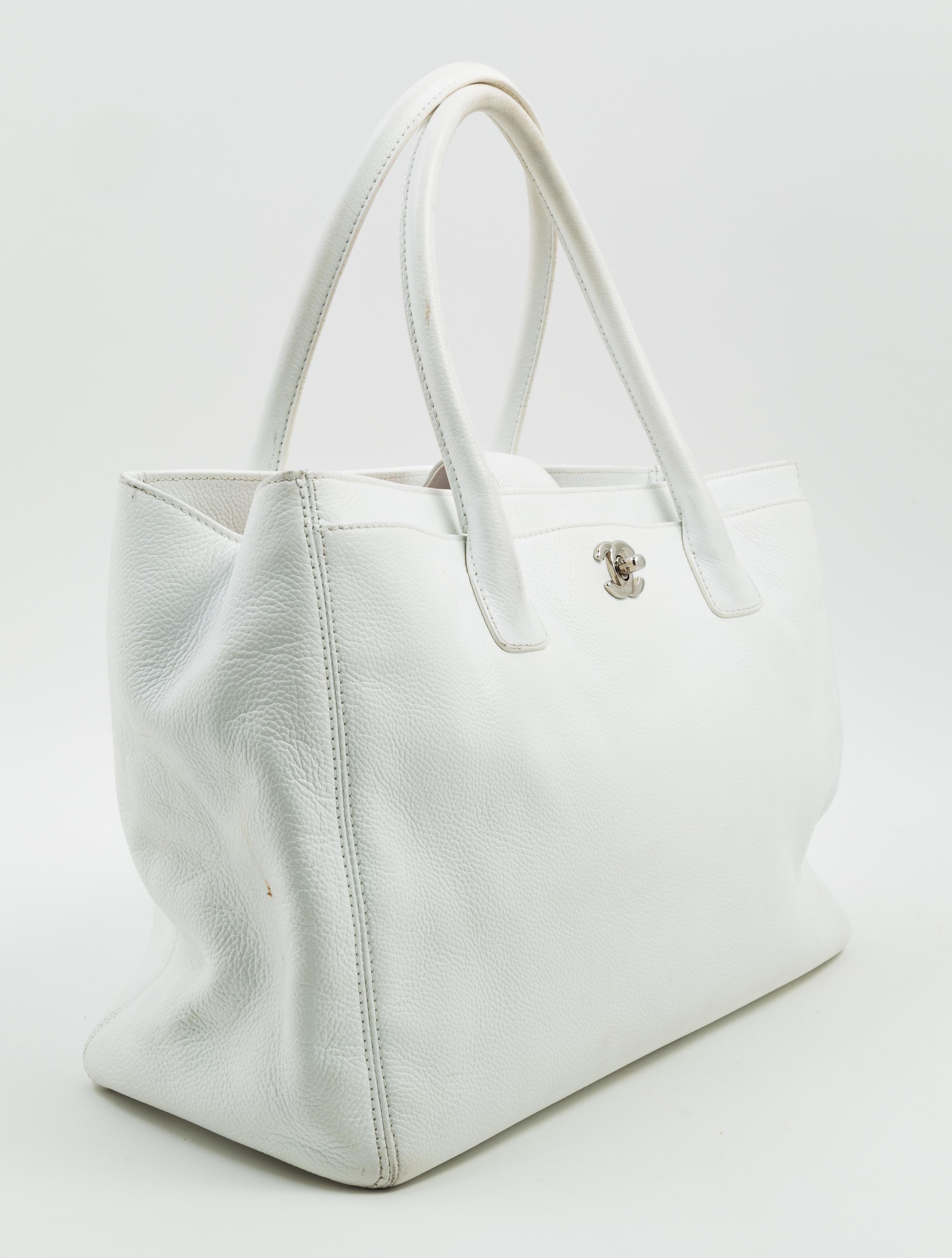 A Chanel White Caviar Tote Bag, 13.3" x 10" x 5.5"; Handle drop: 6.5".