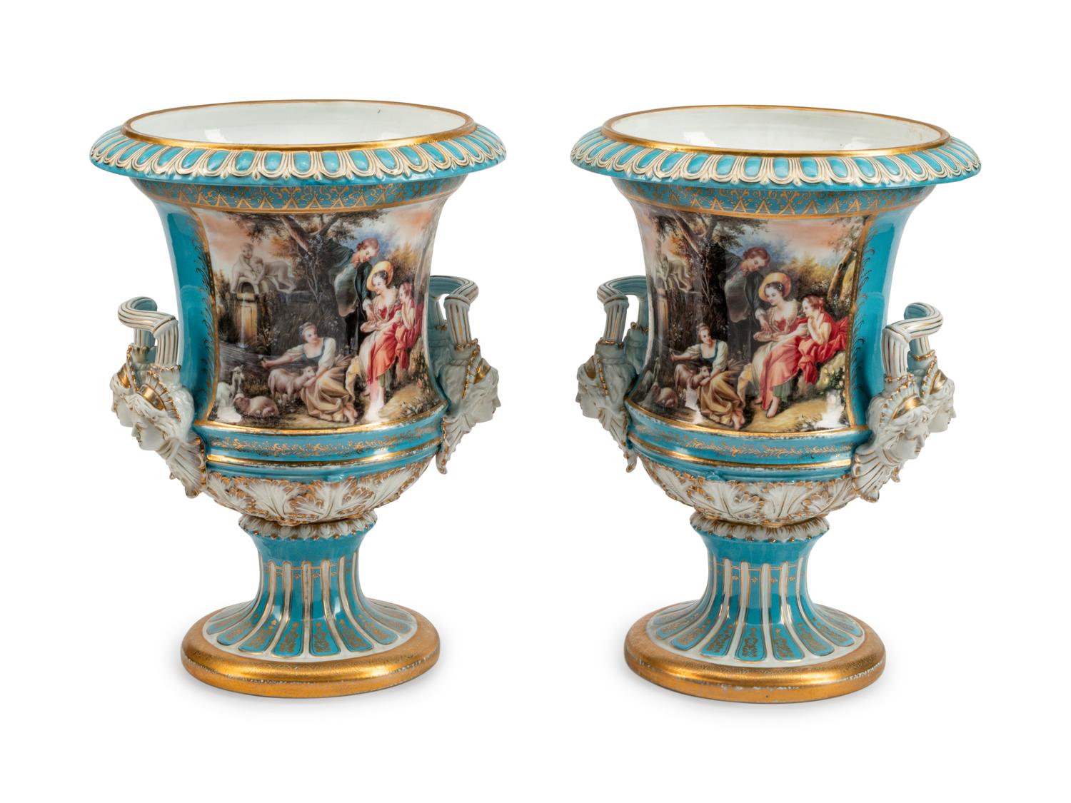 A Large Pair of Continental Porcelain Two-Handled Campana-Form Urns
