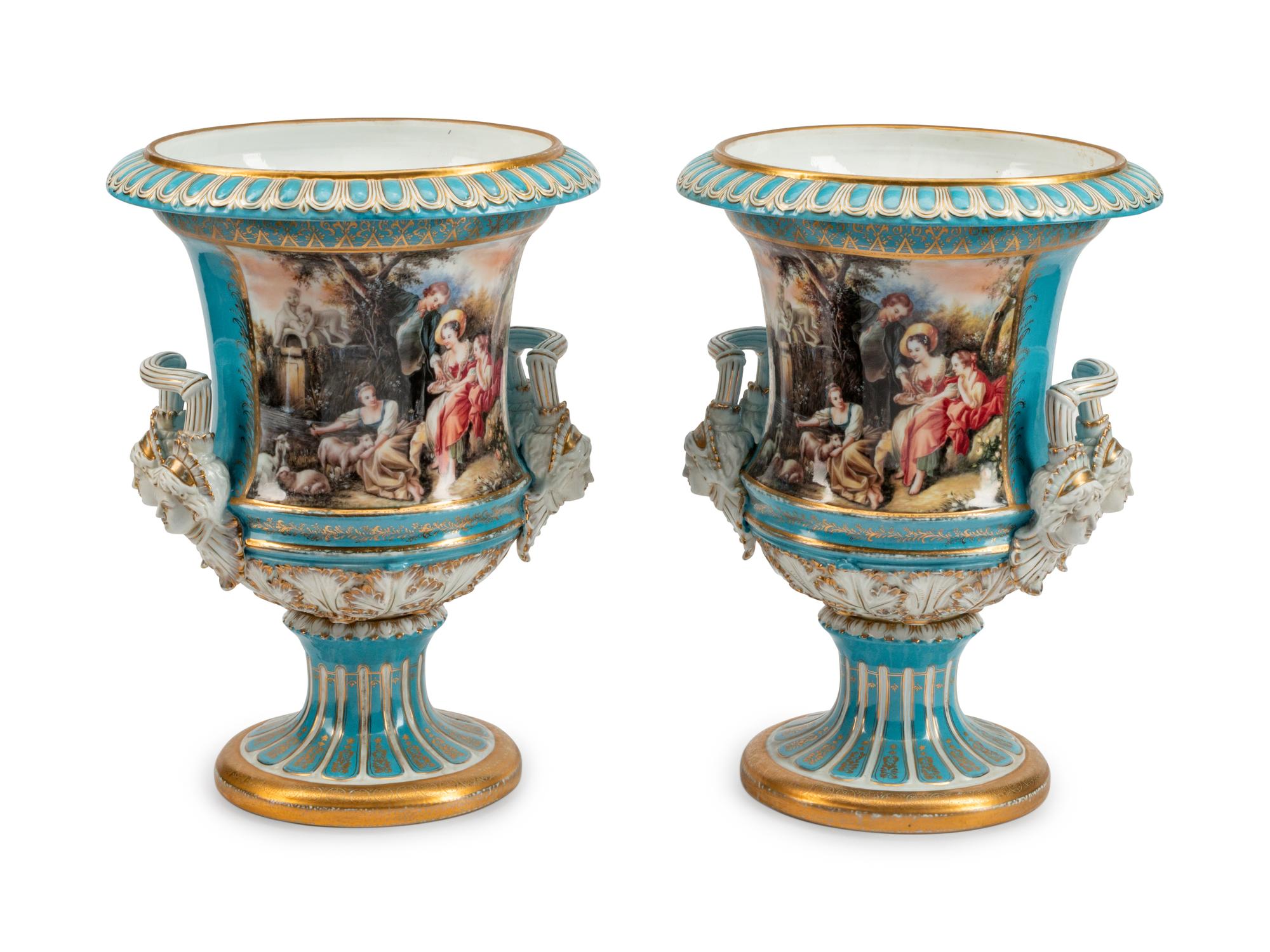 A Large Pair of Continental Porcelain Two-Handled Campana-Form Urns
