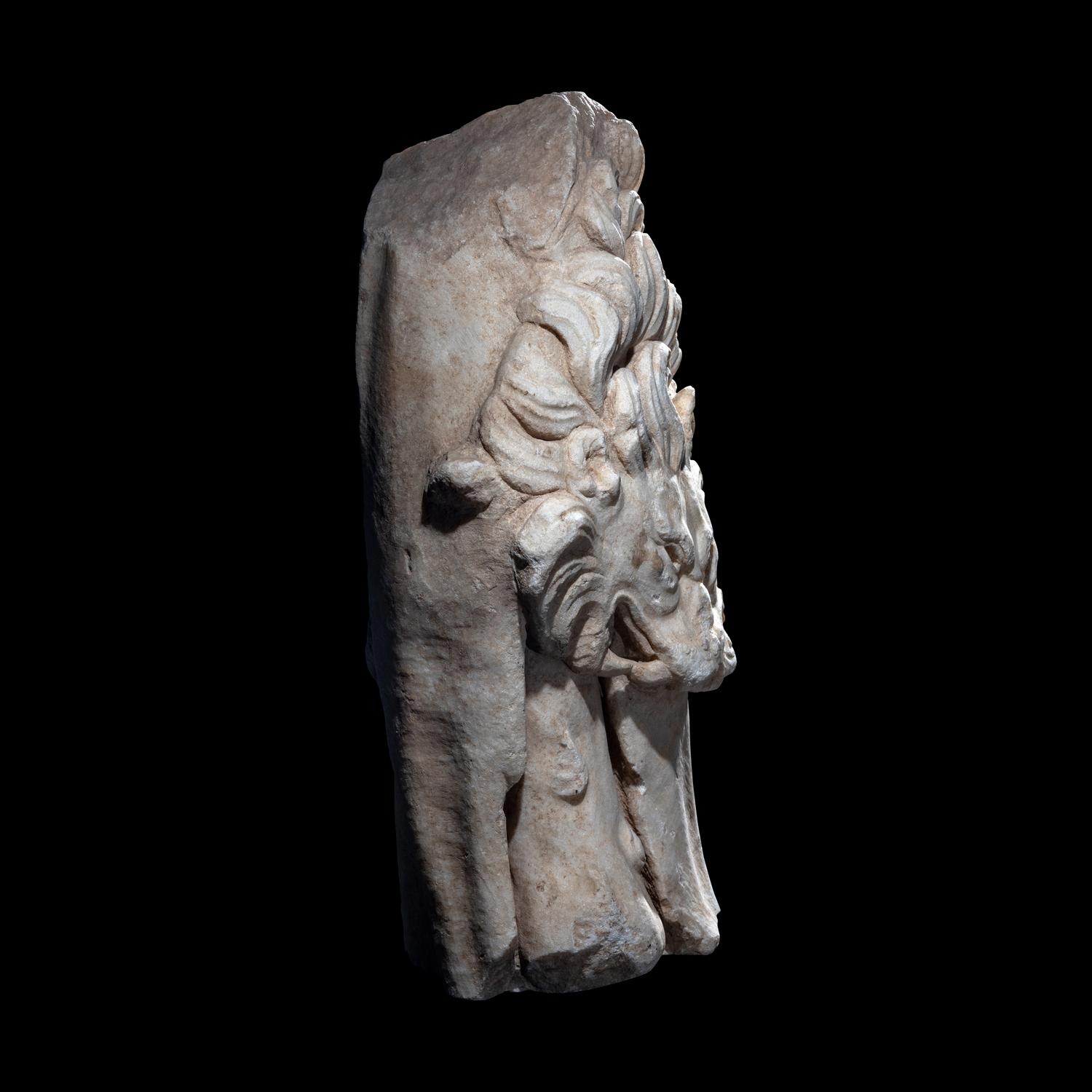 A Roman Marble Support in the form of the Nemean Lion Skin and Club of Hercules