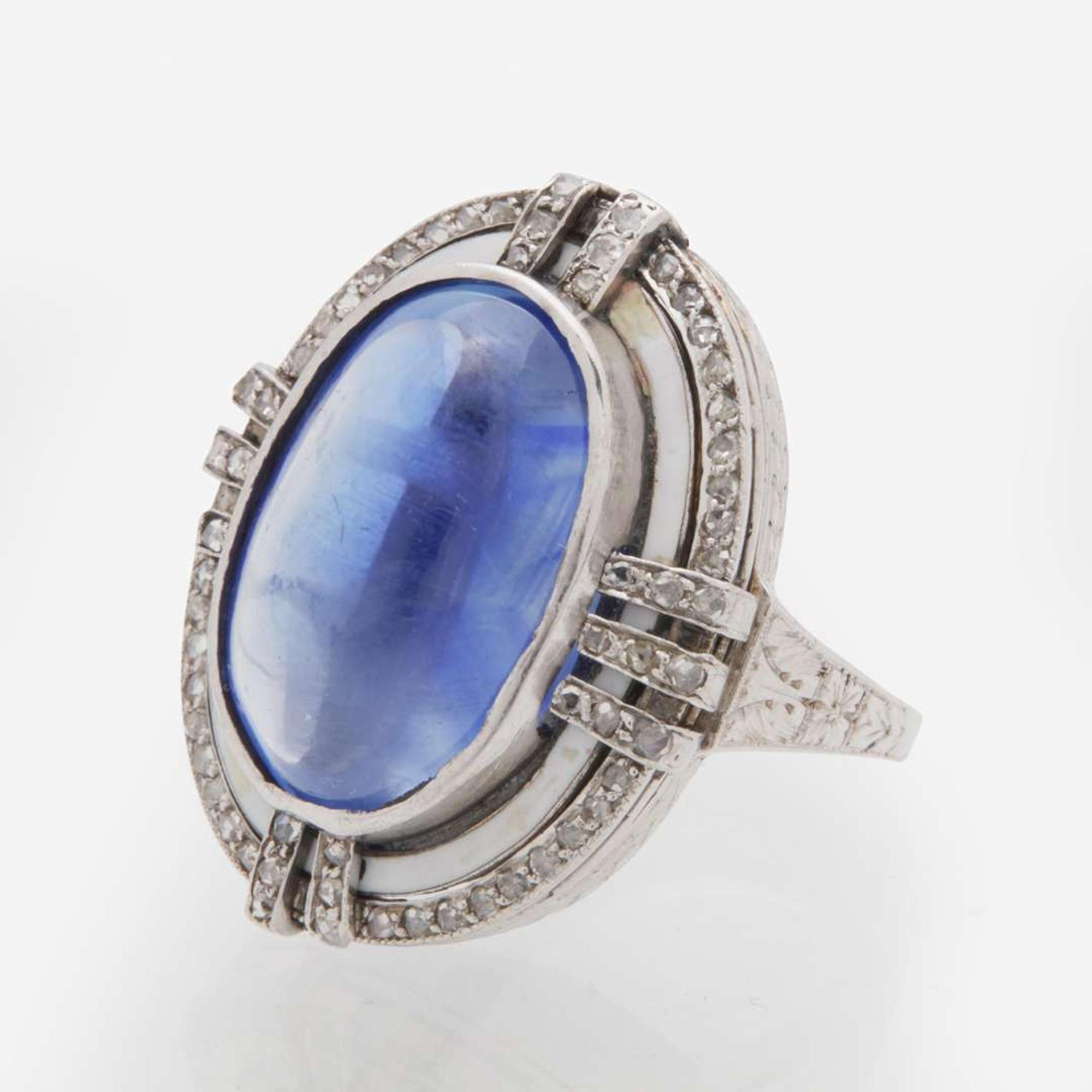 A 14K White Gold, Sugarloaf Sapphire, and Diamond Ring