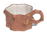 A Chinese Yixing Zisha Pottery Teapot and Four Teacups