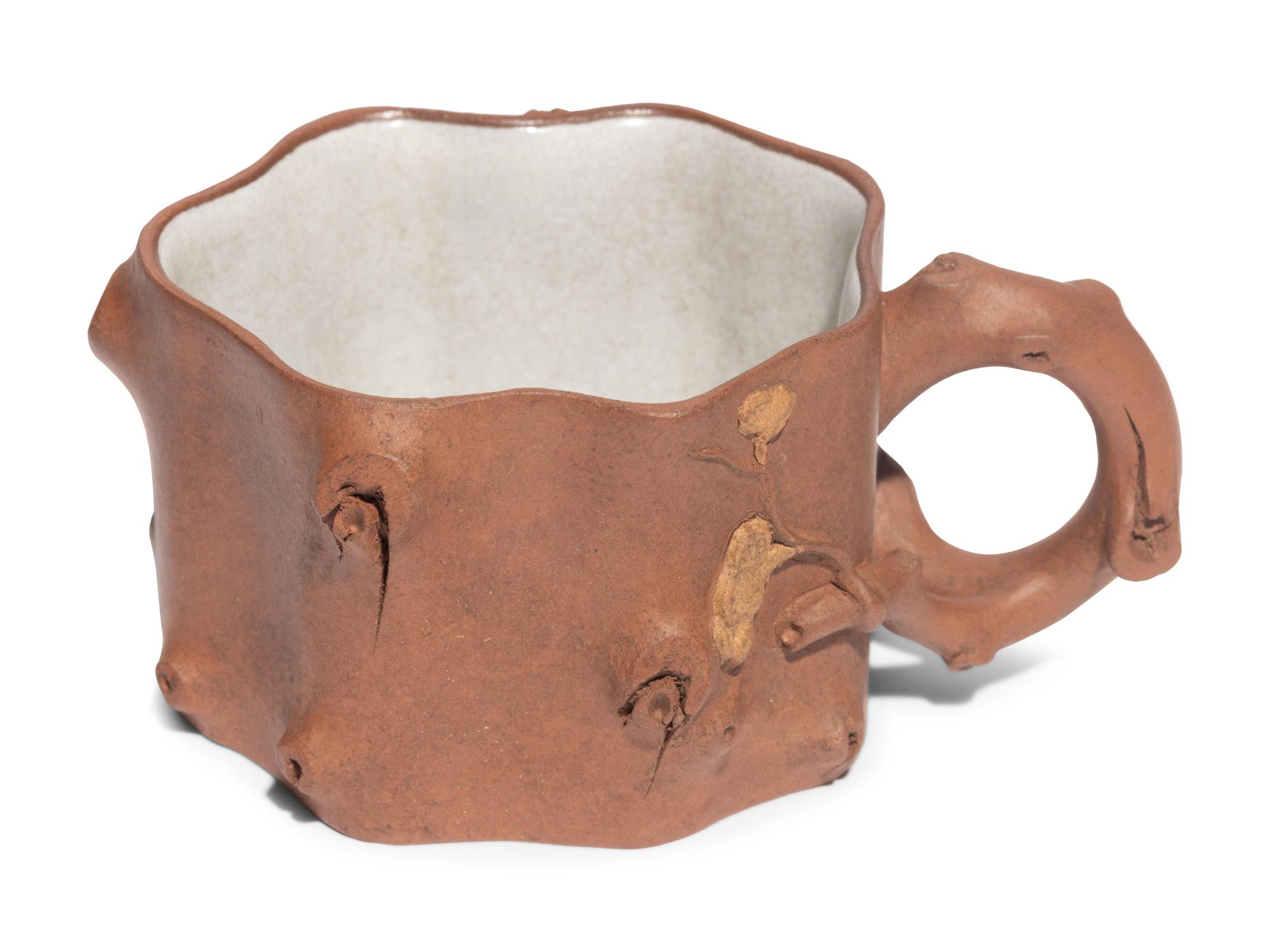 A Chinese Yixing Zisha Pottery Teapot and Four Teacups