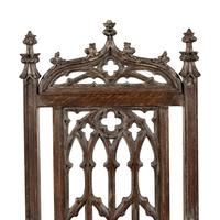An English Gothic Revival Carved Oak Armchair