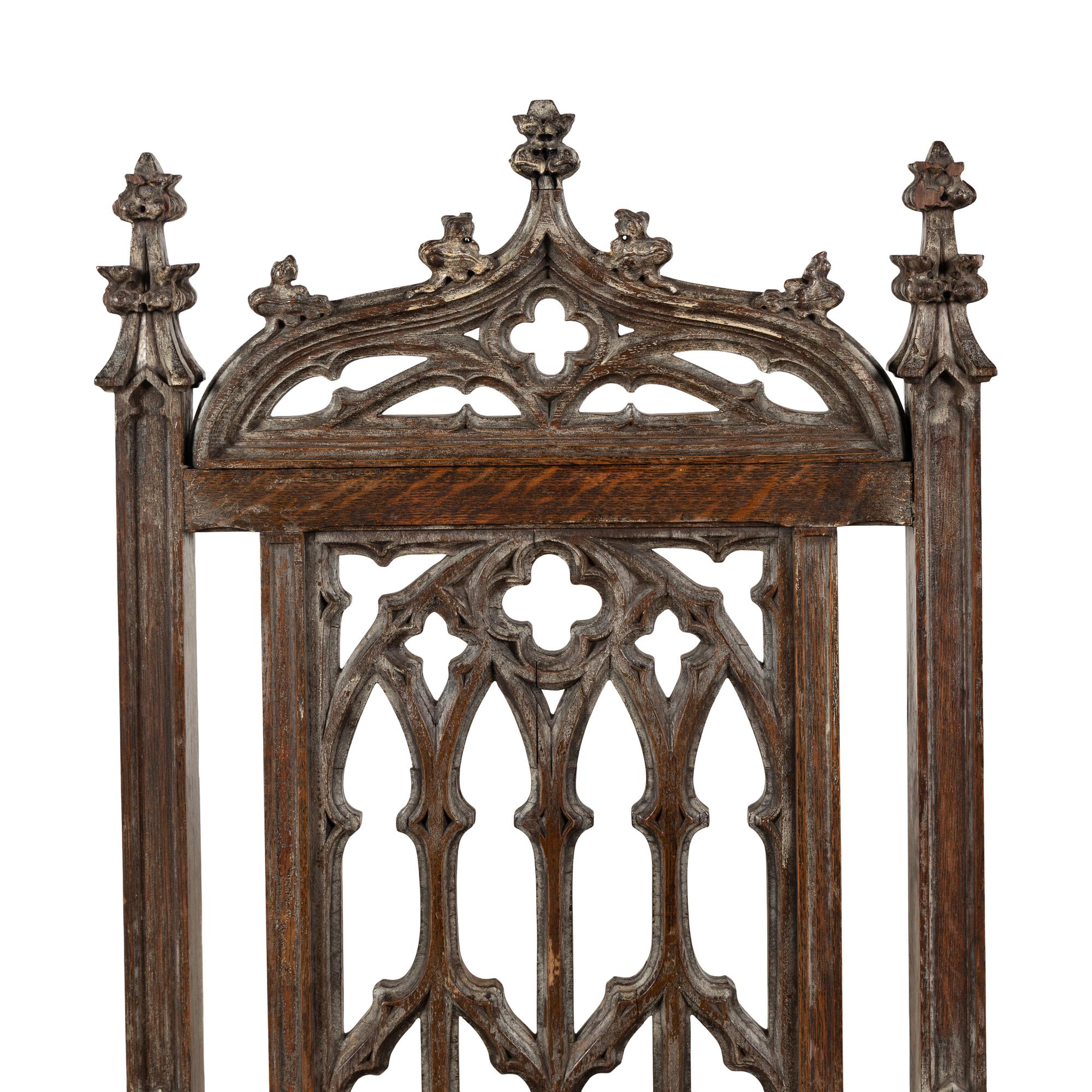 An English Gothic Revival Carved Oak Armchair