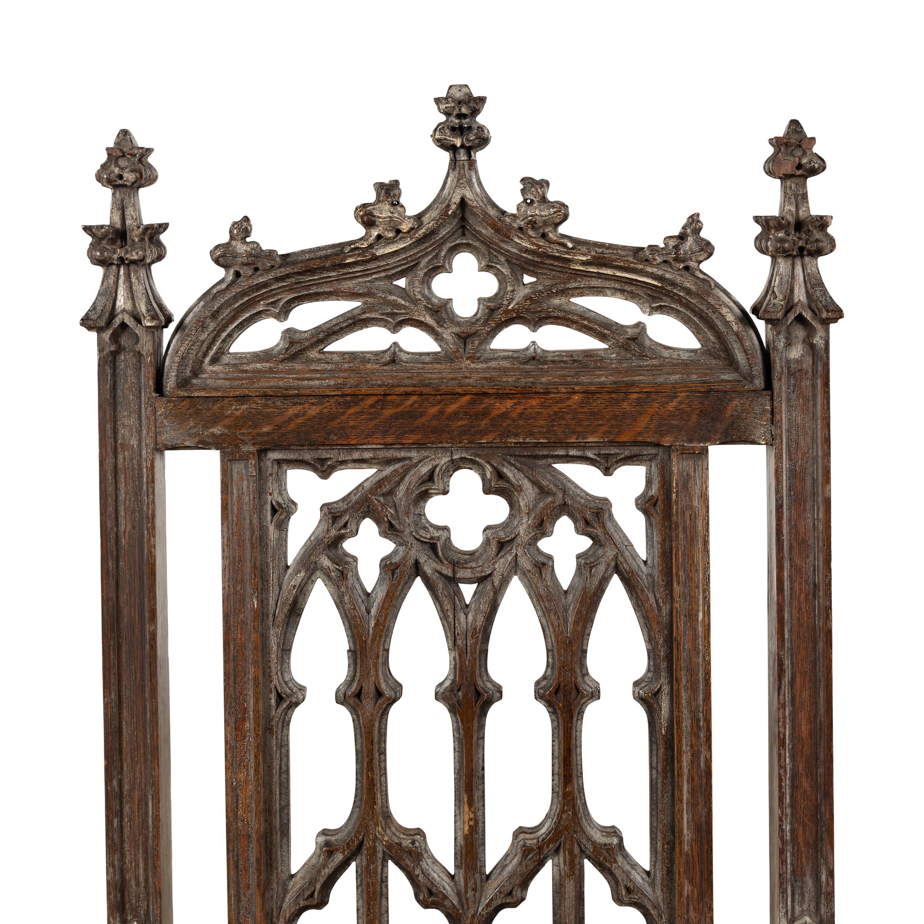An English Gothic Revival Carved Oak Armchair