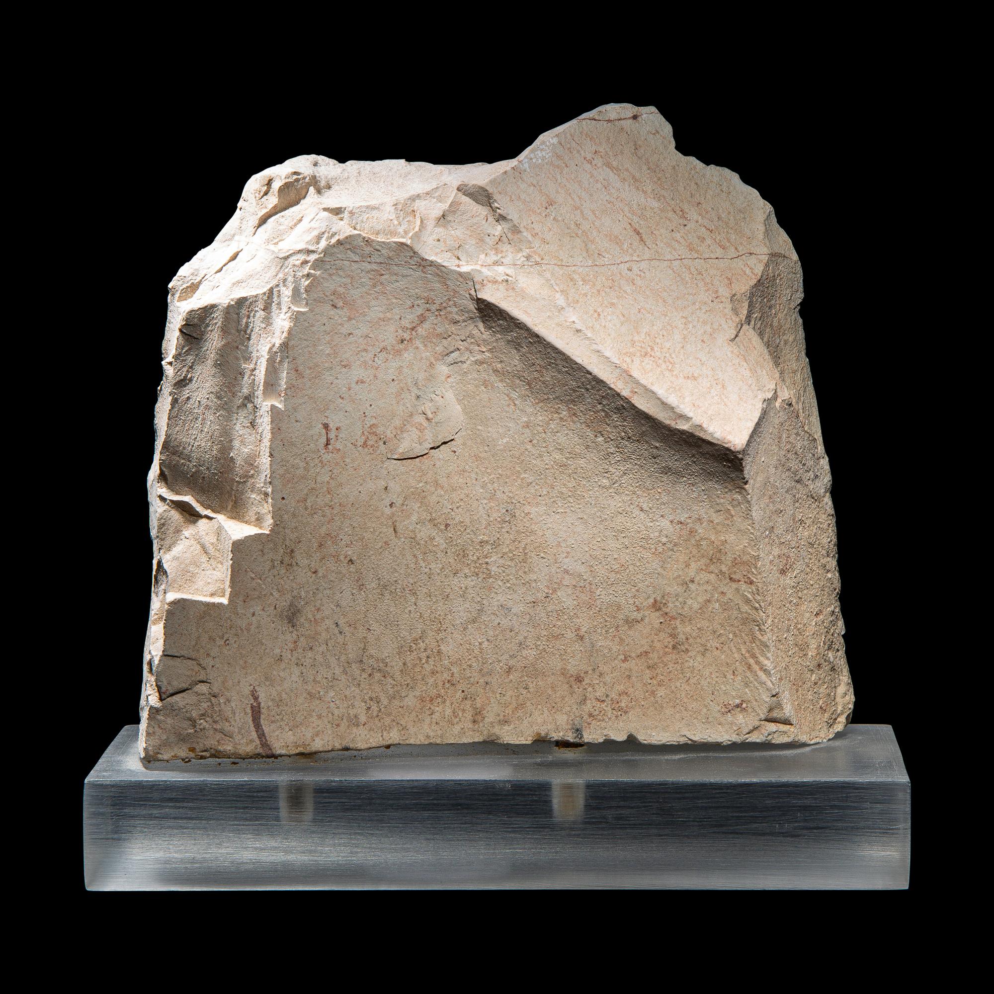 An Egyptian Painted Limestone Relief Fragment