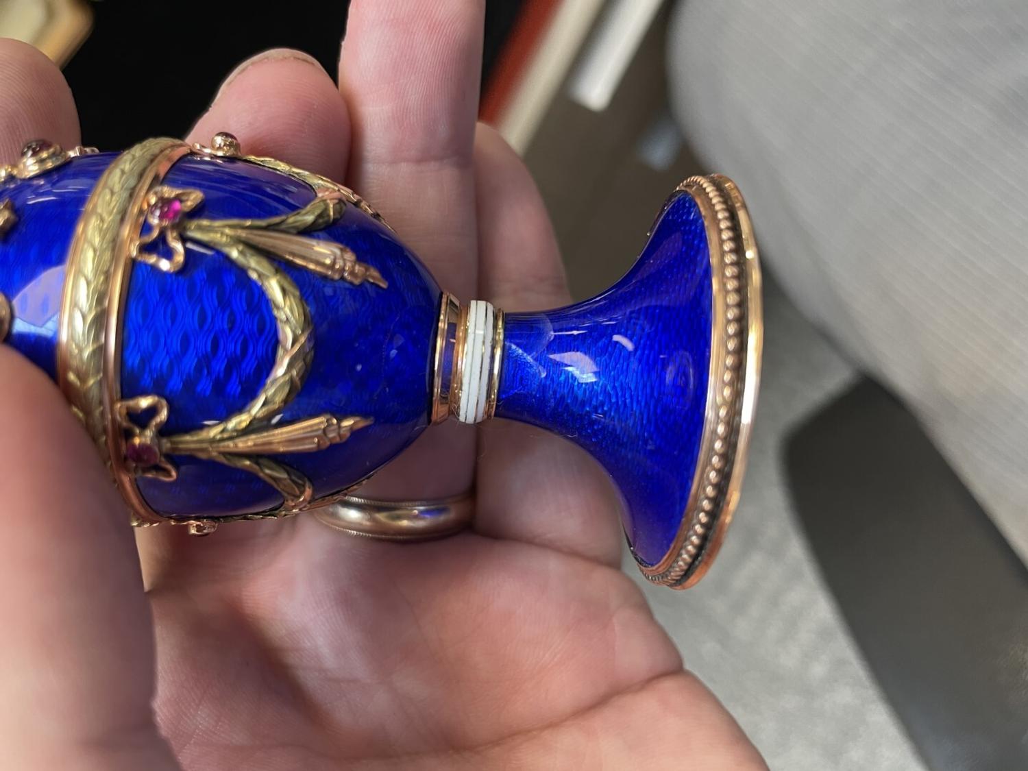 A 14 Karat Vari-Color Gold, Guilloché Enamel, Diamond, and Cabochon Jewel-Mounted Egg-Form Perfume and a Related Guilloché Enamel, 14 Karat Vari-Color Gold, Diamond, and Cabochon-Mounted Surprise Egg
