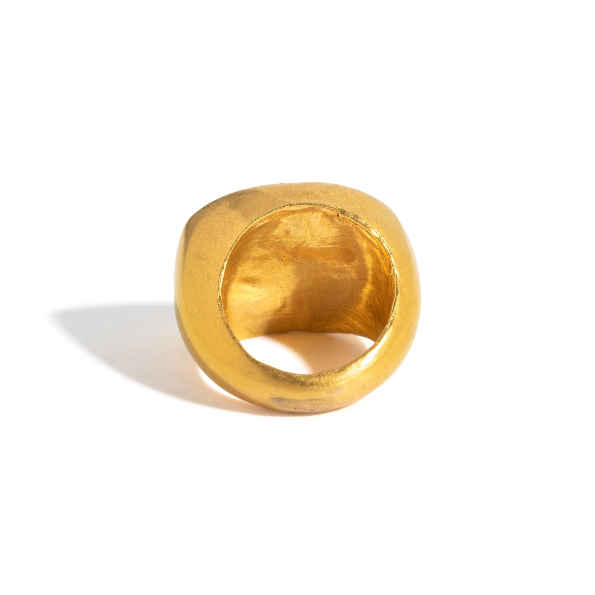 A Greek Gold and Garnet Finger Ring with the Goddess Isis