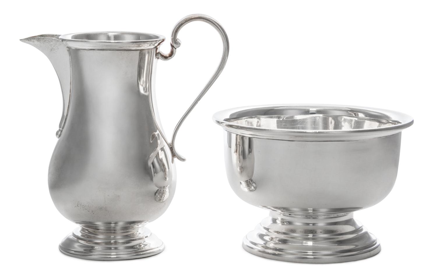 A George V Silver Creamer and Sugar Set, Israel Freeman & Son, Ltd., London, 1935, the creamer of baluster form with a scroll handle, t