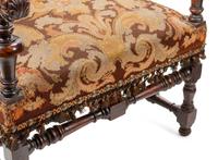 A Pair of William and Mary Style Carved Walnut Armchairs