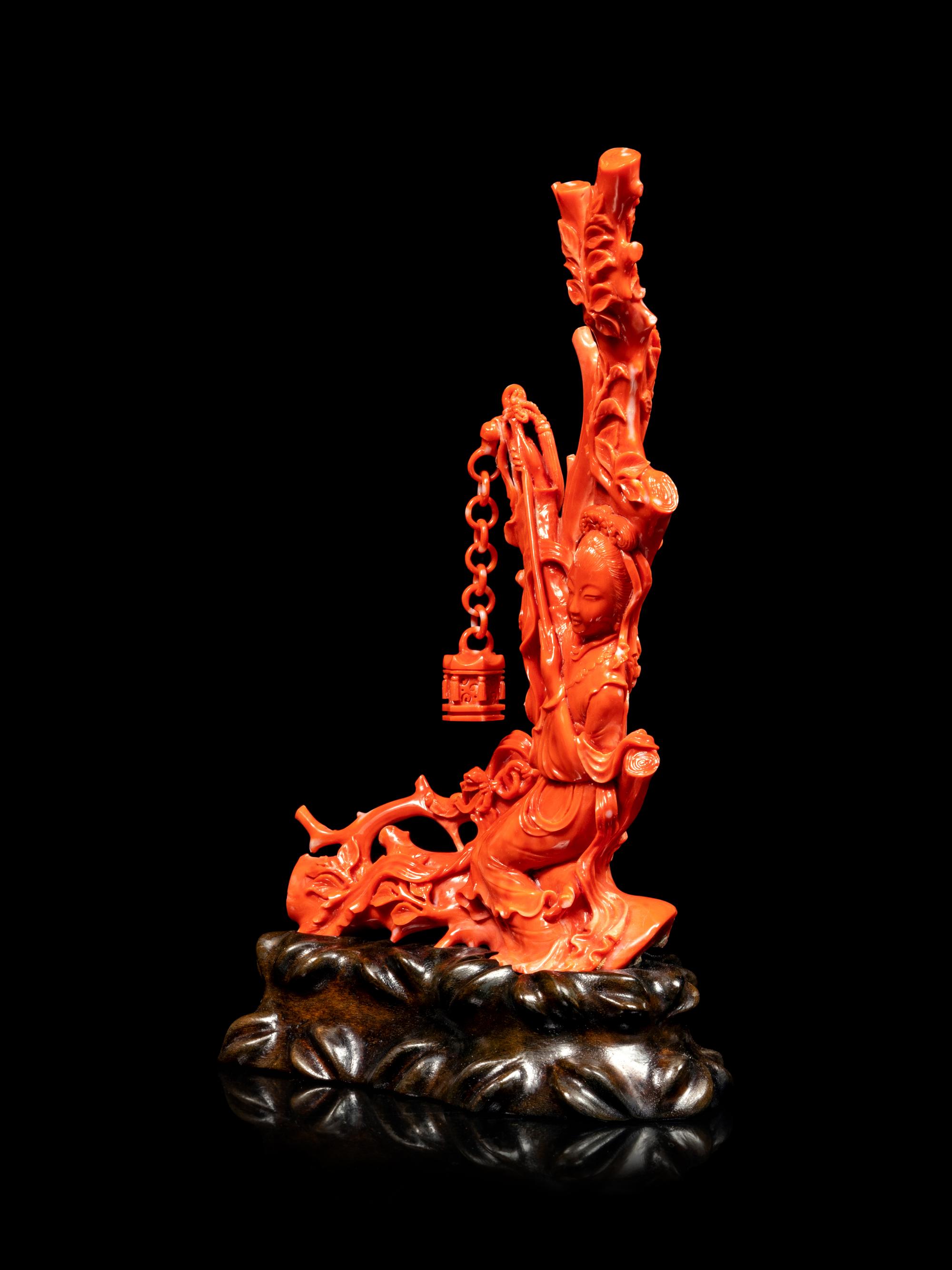 A Carved Red Coral Figure of a Female Immortal