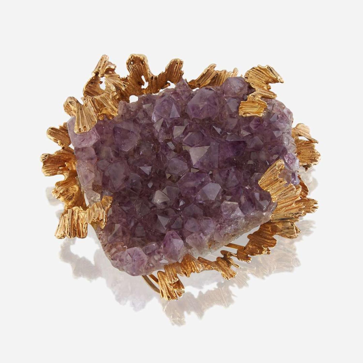 An amethyst geode and fourteen karat gold pendant/brooch
