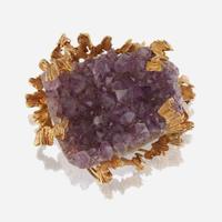 An amethyst geode and fourteen karat gold pendant/brooch