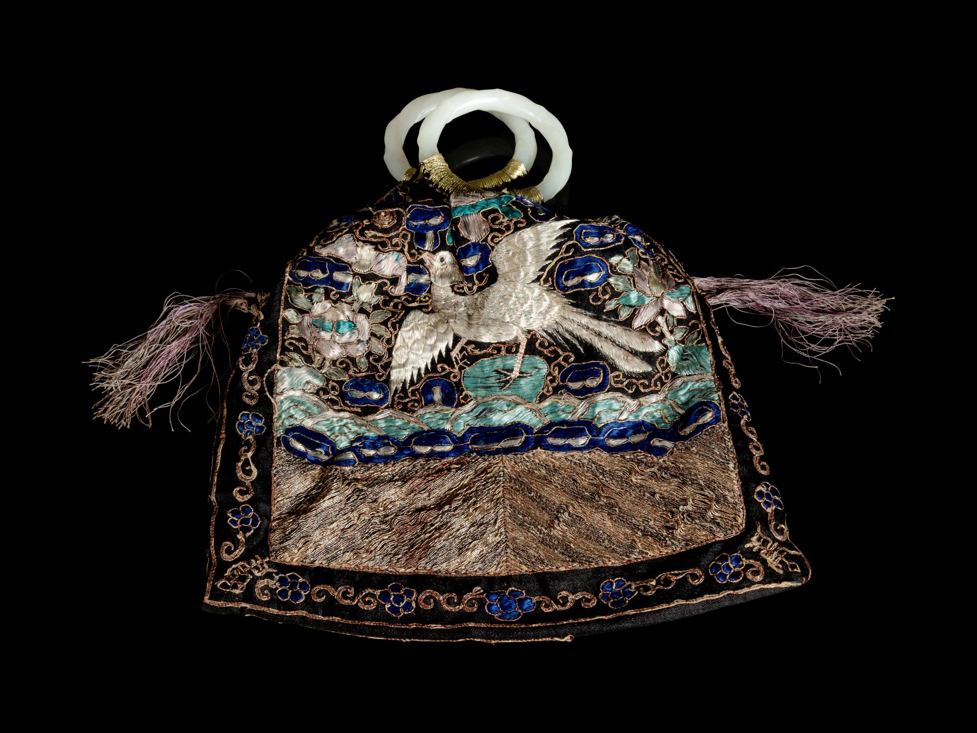 A Chinese Embroidered Silk Purse with a Pair of Jade Bangles