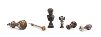 A Collection of Six Silver and Cast Metal Seals, Height of tallest 4 3/4 inches.