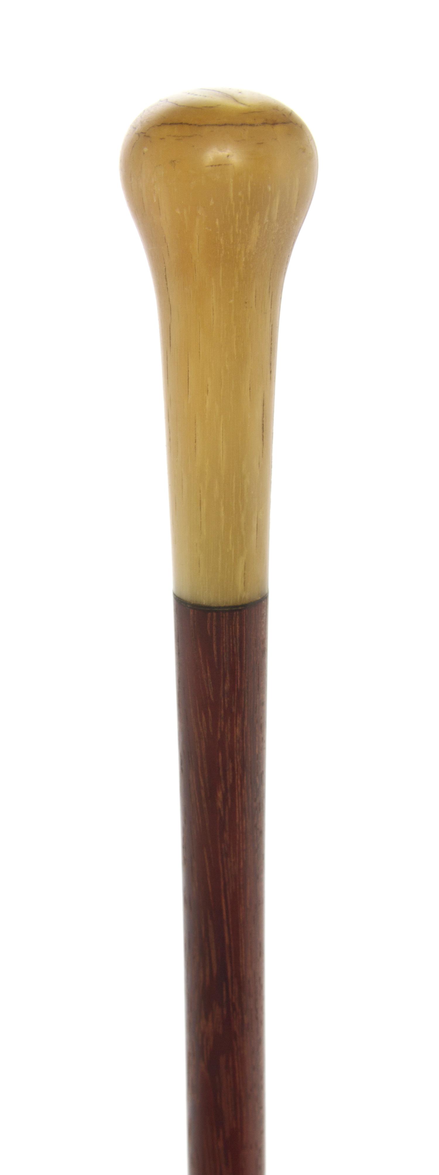 An American Sheephorn Handled Walking Stick, Length of handle 3 1/8 x length overall 36 1/4 inches.