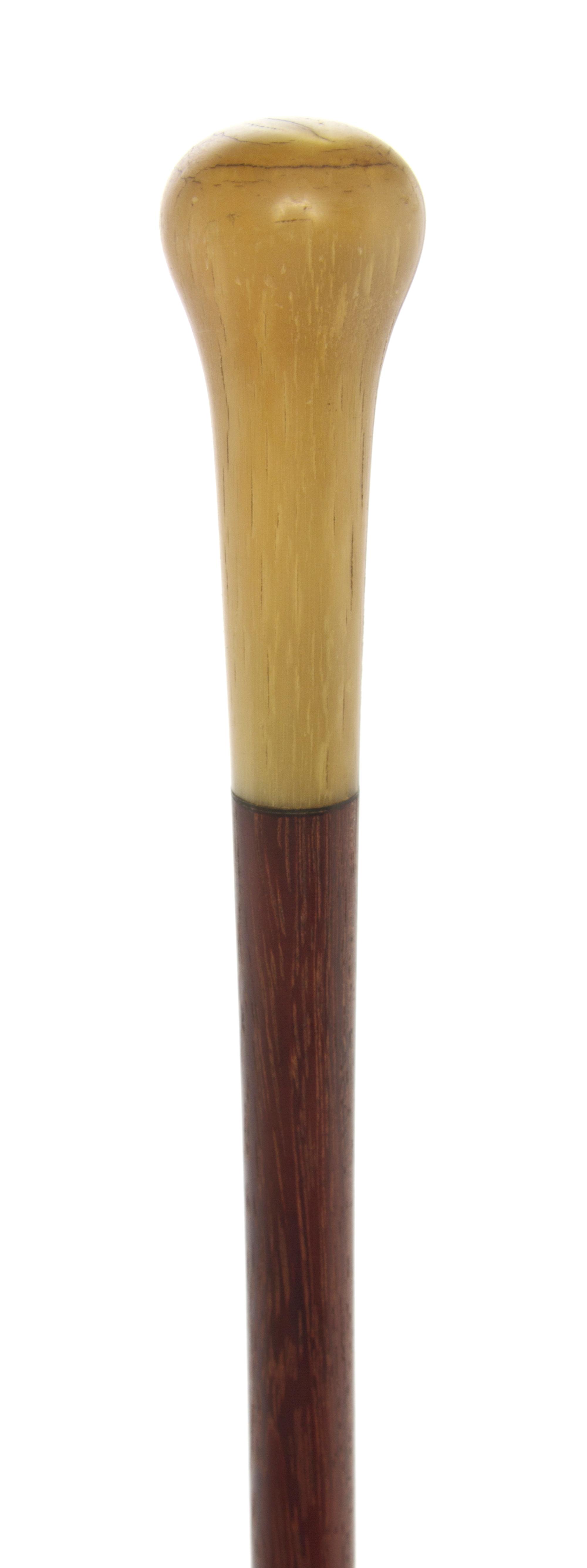 An American Sheephorn Handled Walking Stick, Length of handle 3 1/8 x length overall 36 1/4 inches.