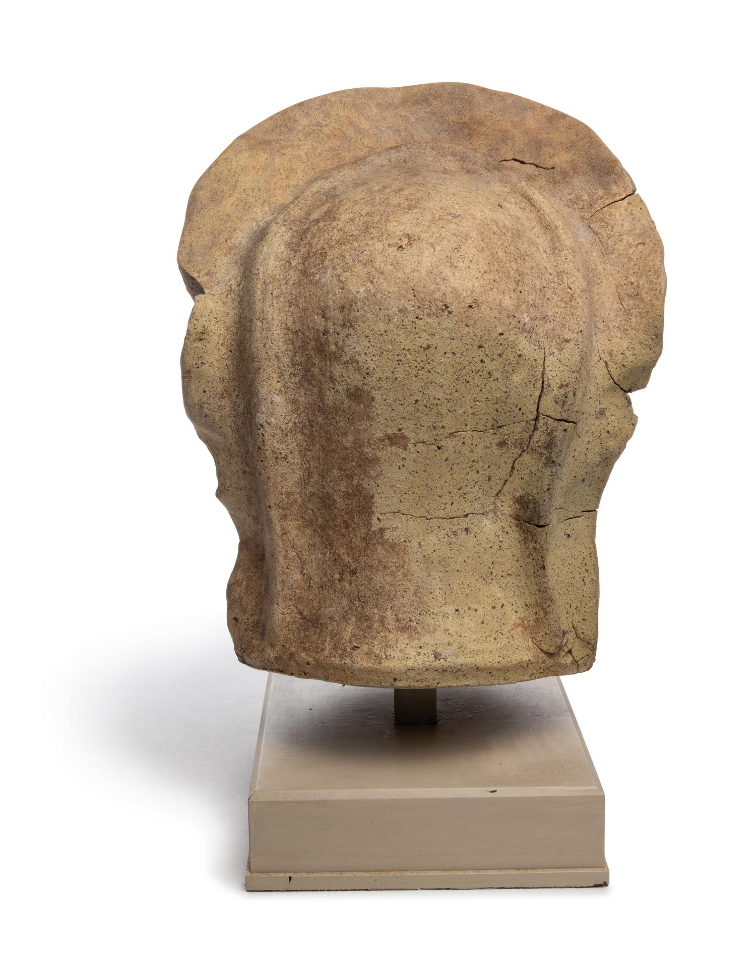 An Etruscan Terra Cotta Votive Head of a Veiled Woman