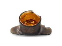 An Aztec Gold-Gilt Obsidian Labret