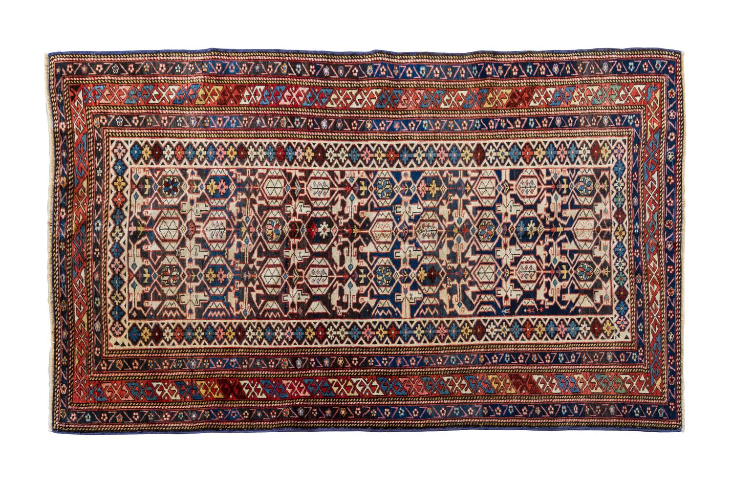 A Caucasian Wool Rug, LATE 19TH CENTURY, 5 feet 5 inches x 3 feet 4 inches. — LATE 19TH CENTURY