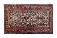 A Caucasian Wool Rug, LATE 19TH CENTURY, 5 feet 5 inches x 3 feet 4 inches. — LATE 19TH CENTURY