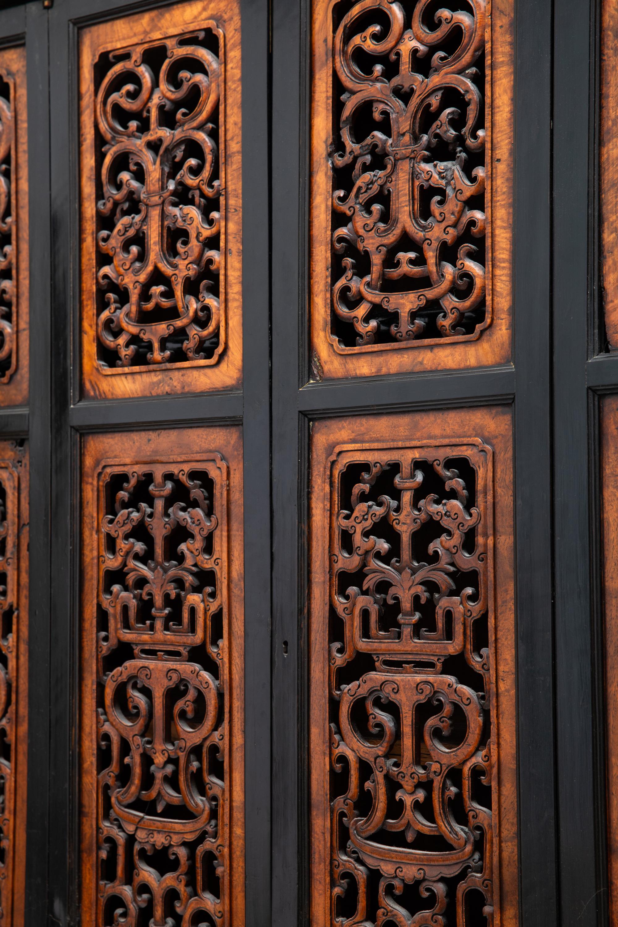 A Chinese Part-Ebonized Burlwood Cupboard