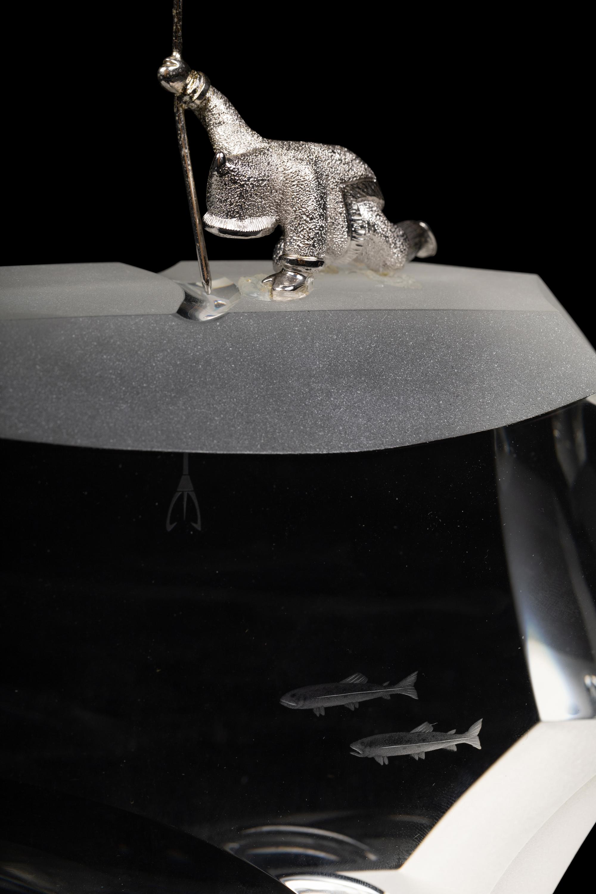A Steuben Glass and Silver Arctic Fisherman Sculpture