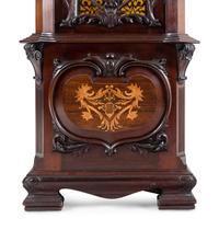 A Victorian Carved Mahogany and Marquetry Nine-Tube Tall Case Clock