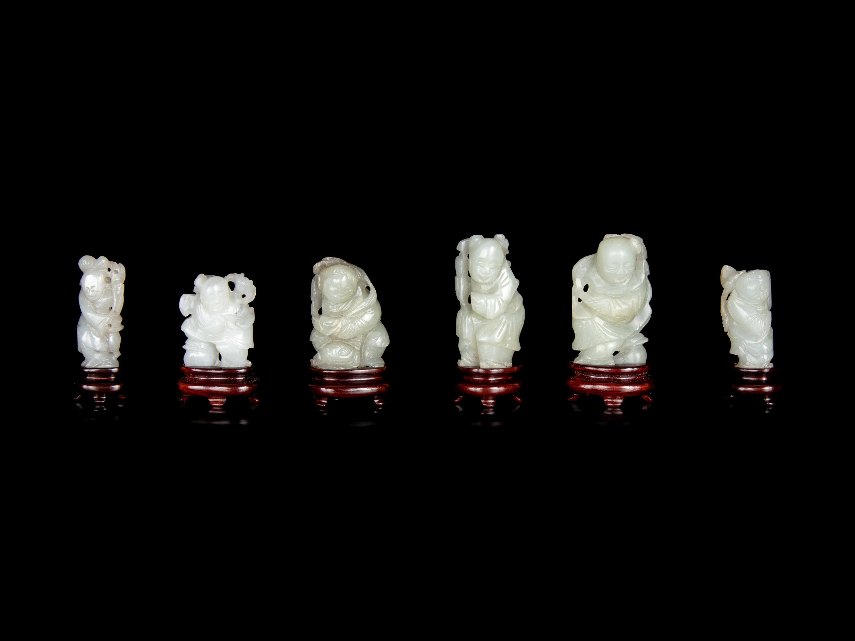 Six Chinese Carved Celadon Jade Figures of Boys