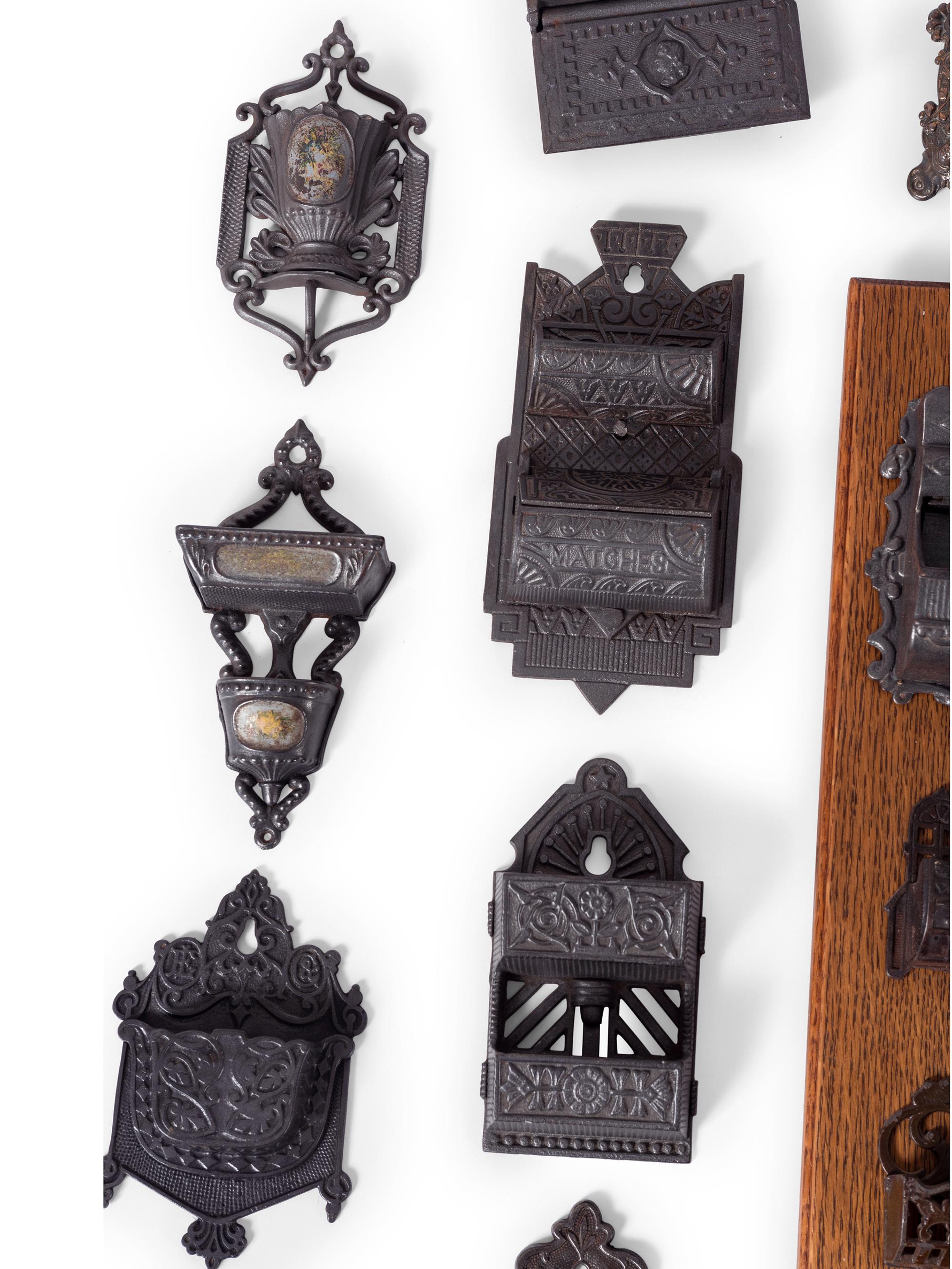 A Group of Cast Iron Hanging Match Holders