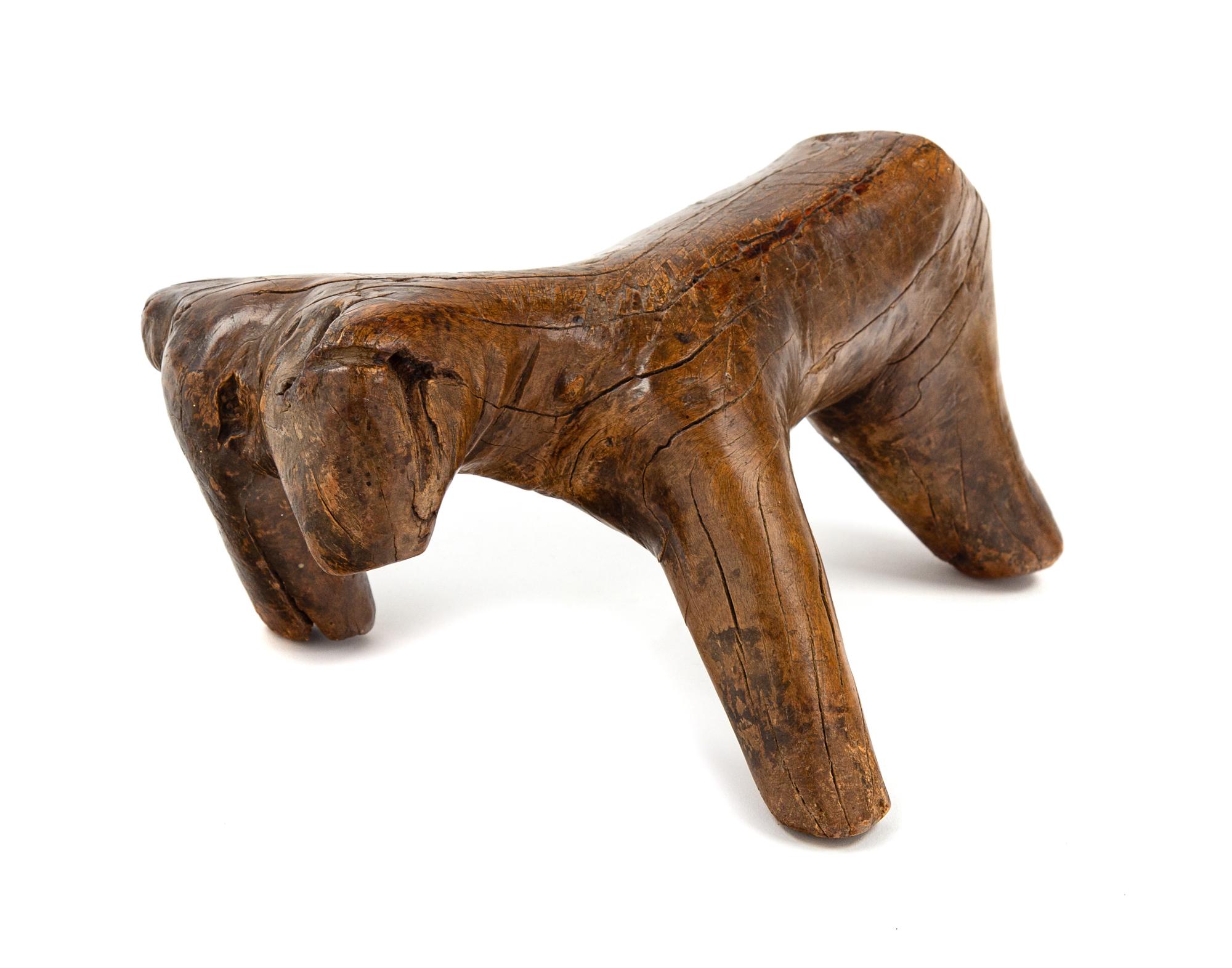 A Chinese Wood Figure of an Ox Length 9 1/2 inches.