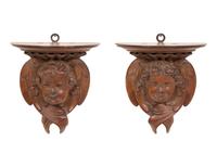 A Pair of English Carved Pear Wood Cherub Wall Brackets