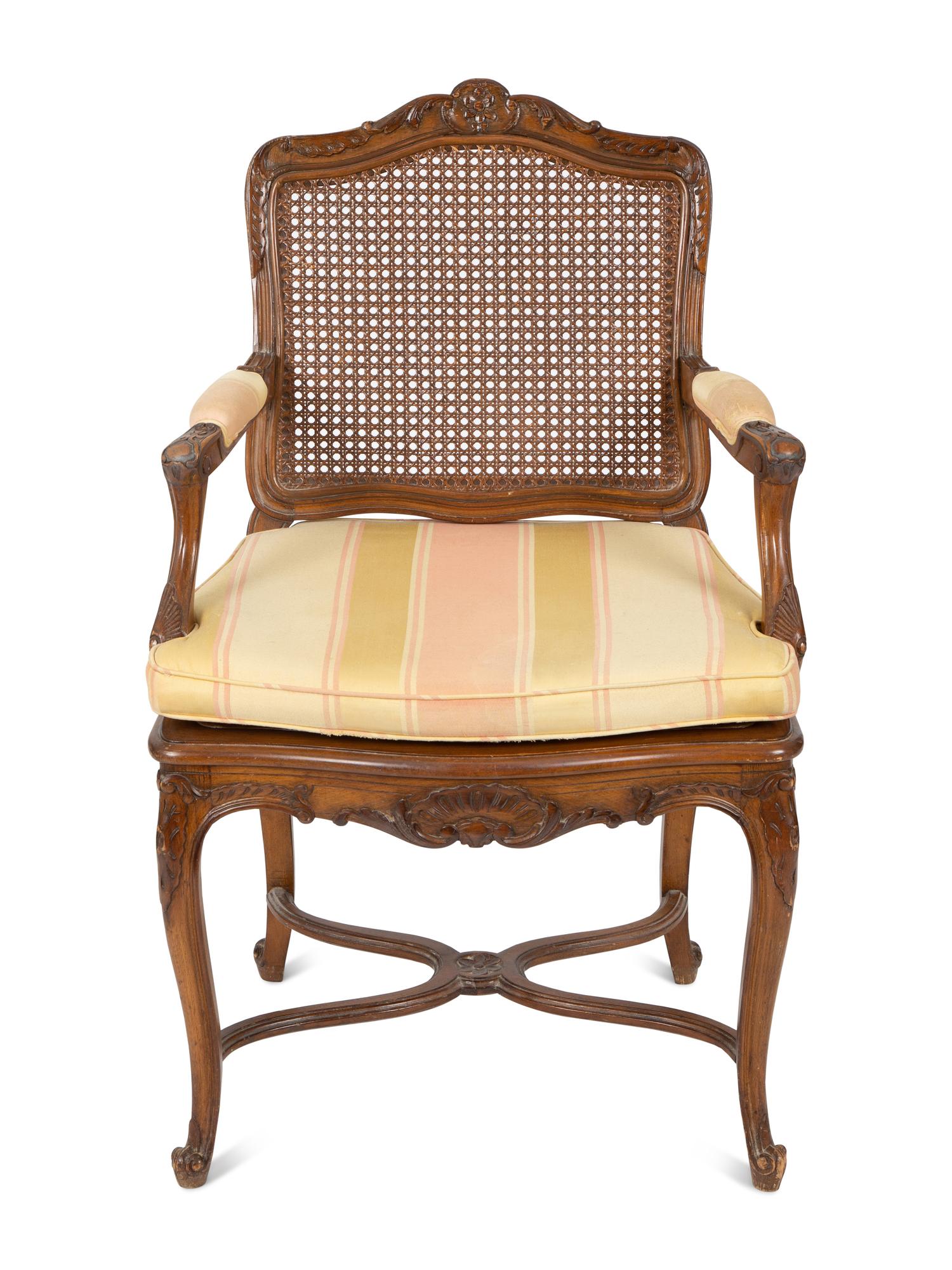 A Louis XV Style Carved Mahogany Cane Seat and Back Fauteuil — 20TH CENTURY