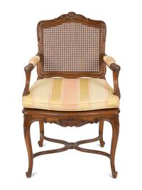 A Louis XV Style Carved Mahogany Cane Seat and Back Fauteuil — 20TH CENTURY