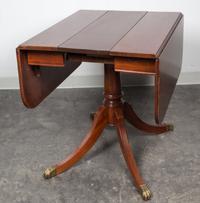 A Regency Style Mahogany Drop Leaf Table Height 29 5/8 x width 36 x depth 19 3/4 inches (closed). — 20TH CENTURY