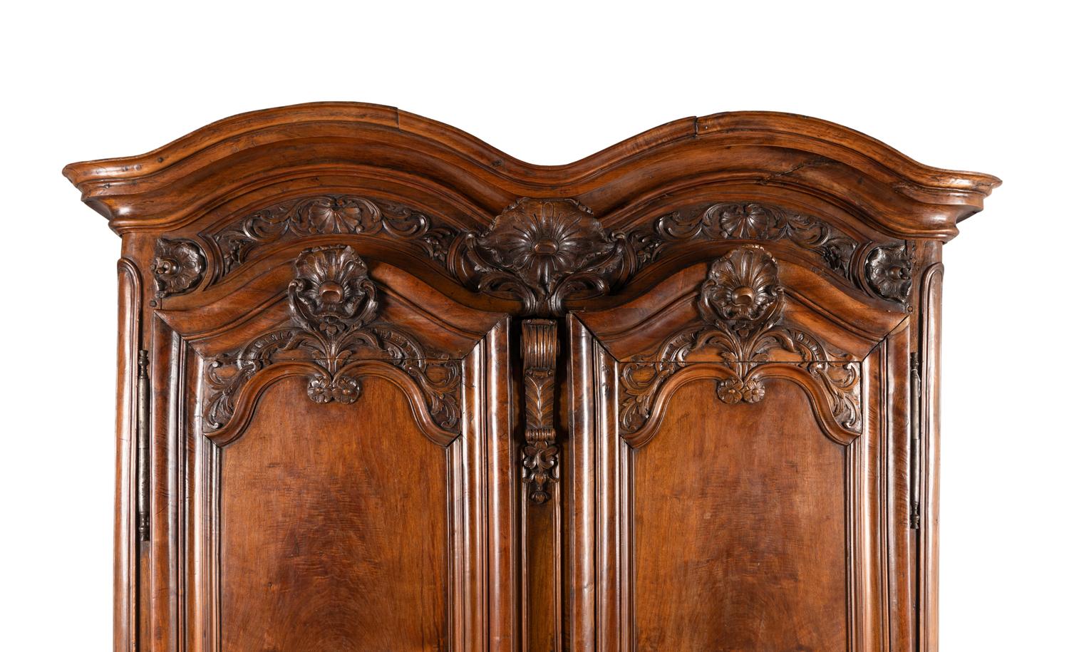 A Louis XV Carved Walnut Armoire