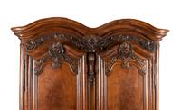 A Louis XV Carved Walnut Armoire