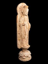 A Chinese Carved Stone Standing Buddha with Remnants of Gilt on Lotus-Form Base