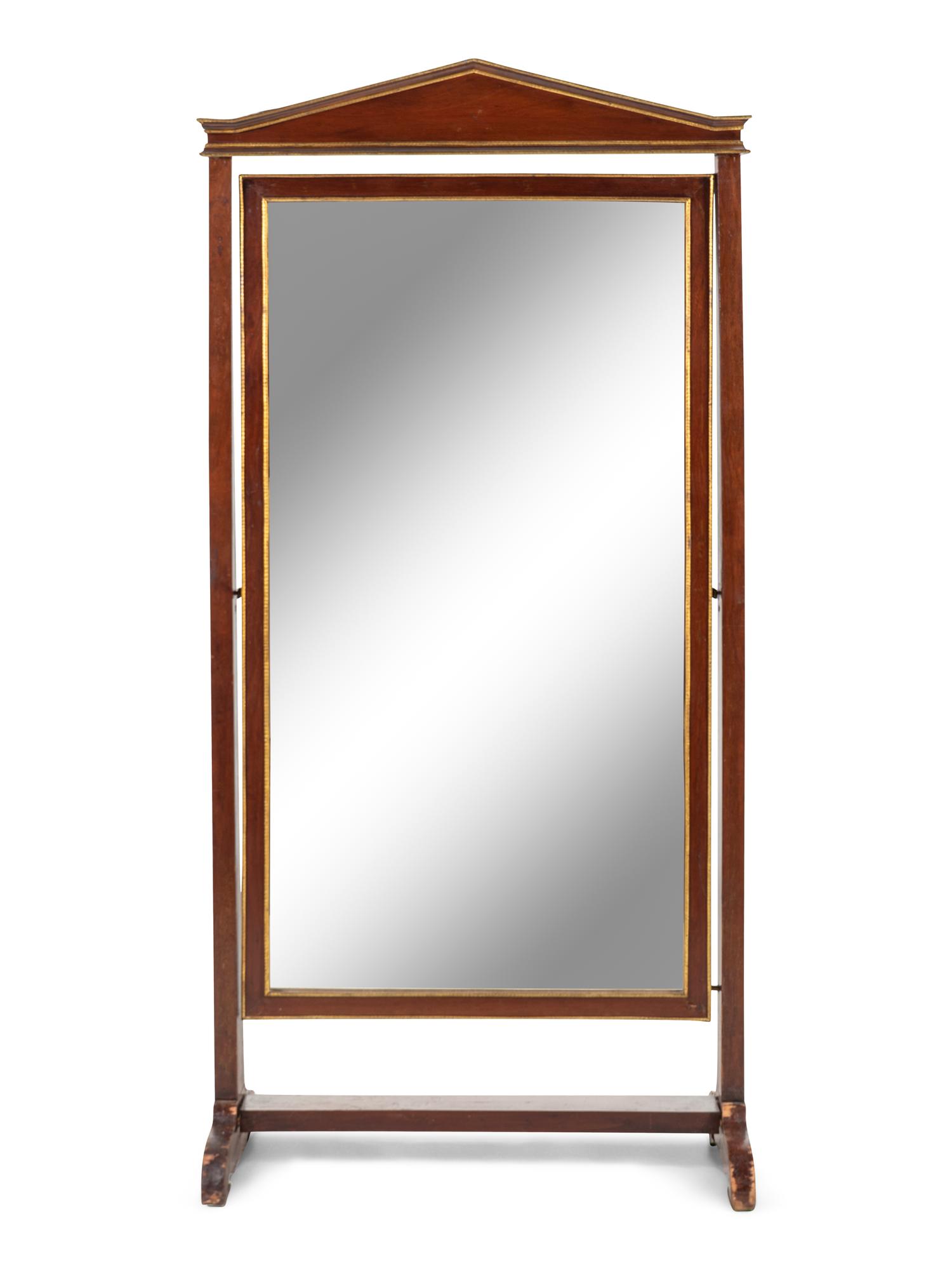 A Continental Parcel Gilt Mahogany Cheval Mirror