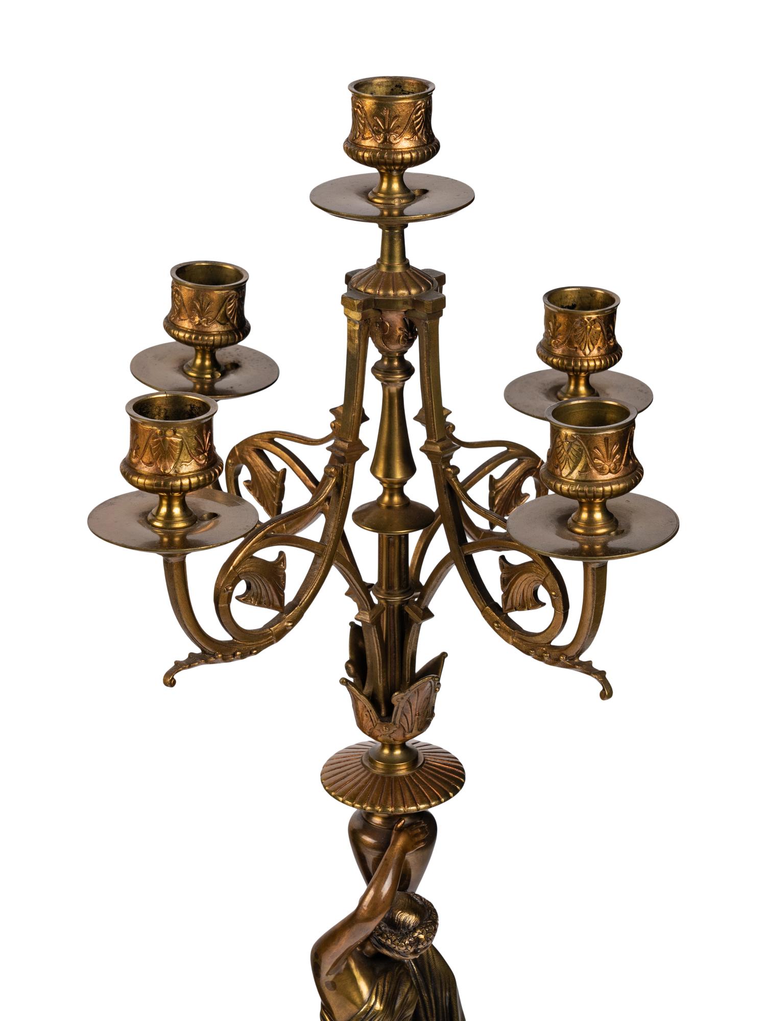 A French Neoclassical Gilt Bronze and Rouge Marble Clock Garniture