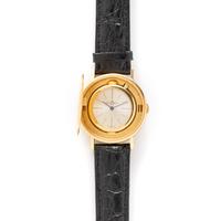 BAUME & MERCIER, YELLOW GOLD HIDDEN DIAL COIN WATCH