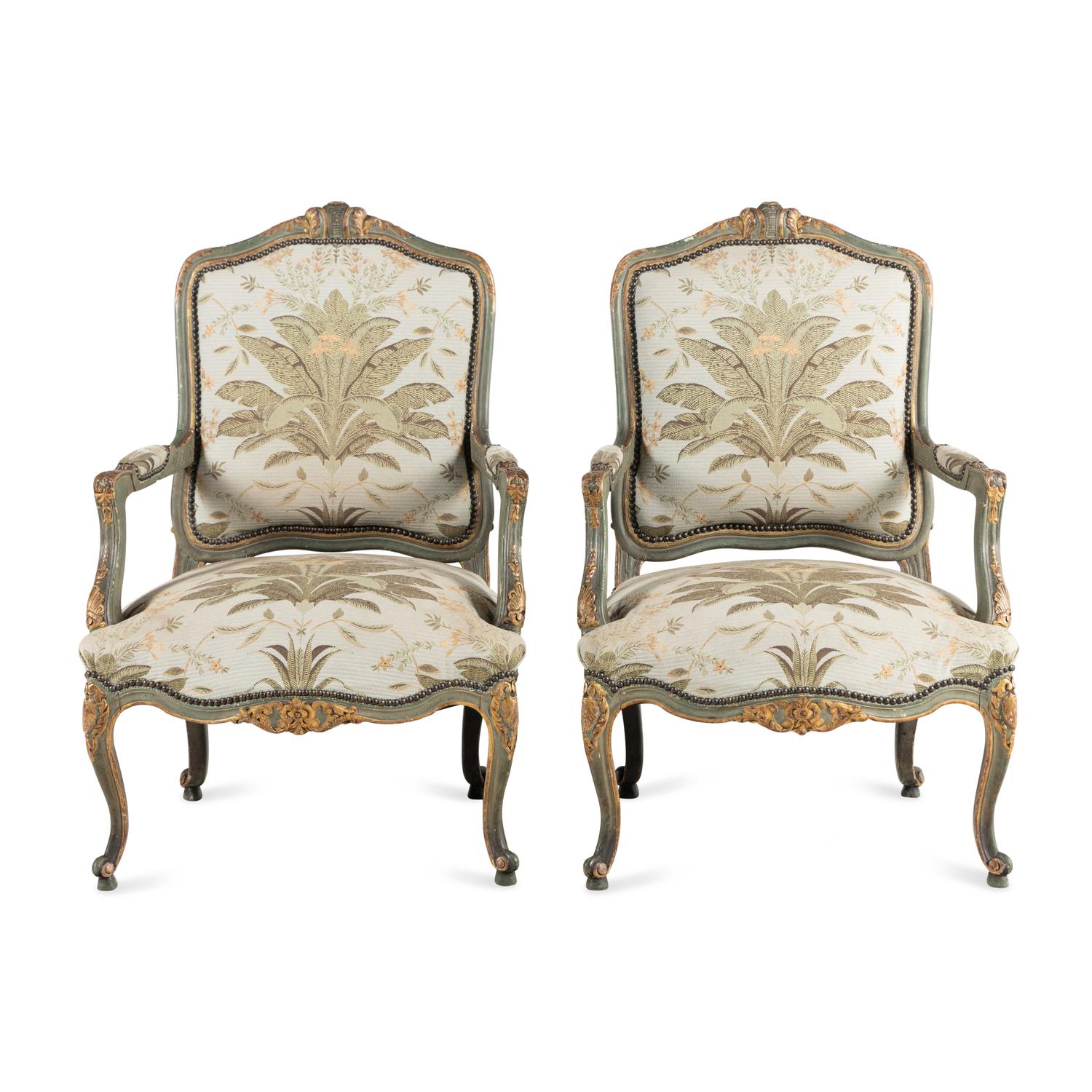A Pair of Italian Rococo Style Painted and Parcel Gilt Armchairs