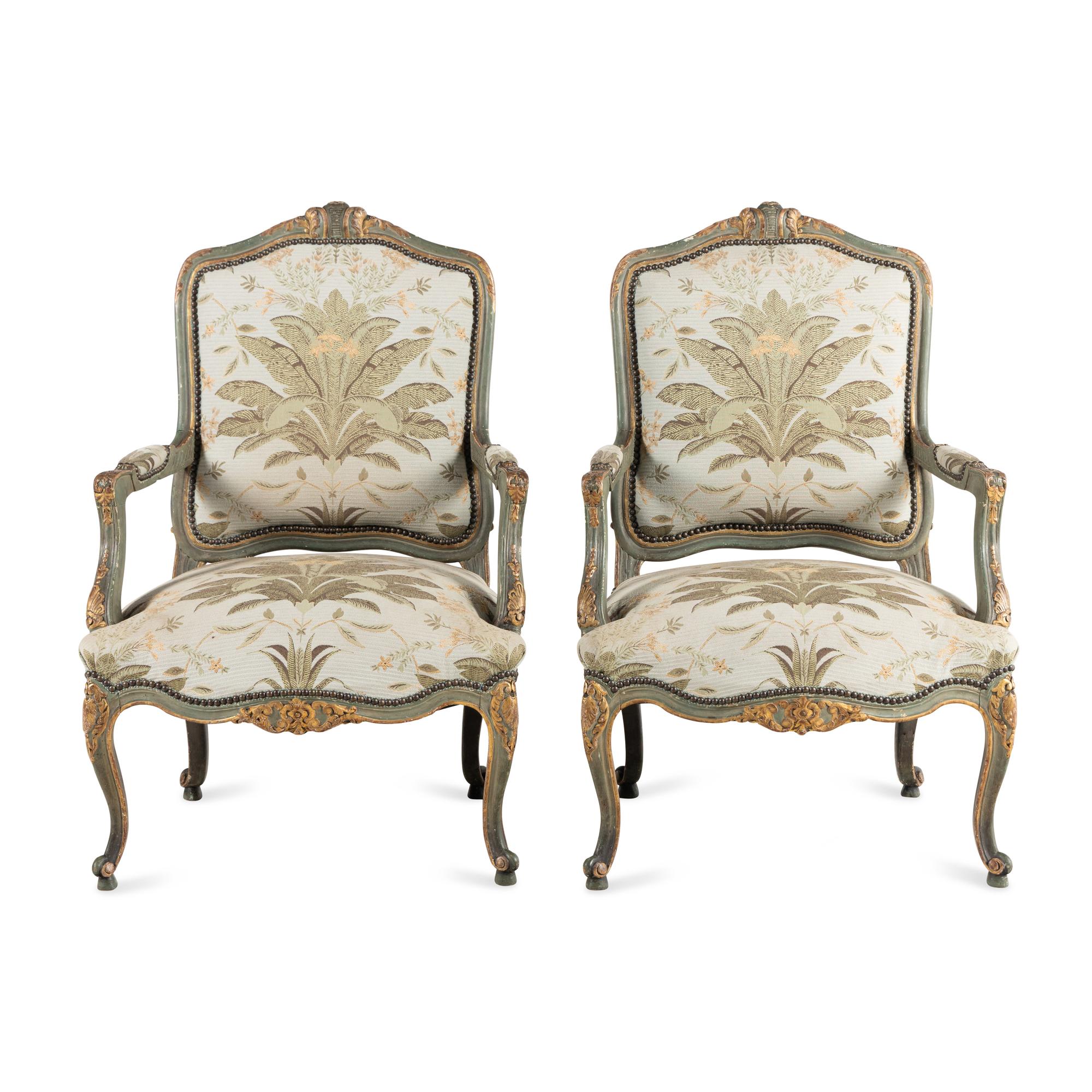 A Pair of Italian Rococo Style Painted and Parcel Gilt Armchairs