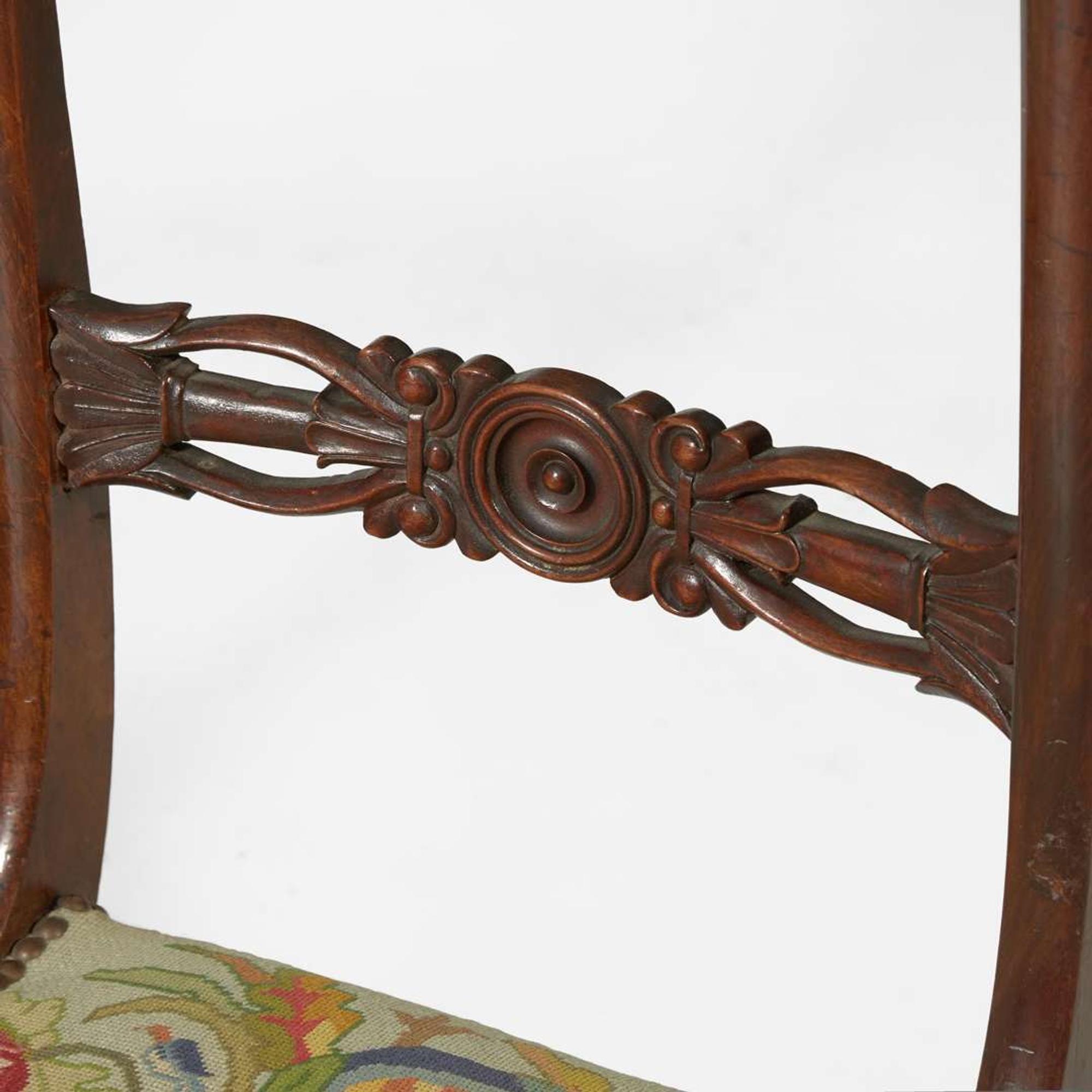 A group of four Regency carved mahogany side chairs circa 1810-1820