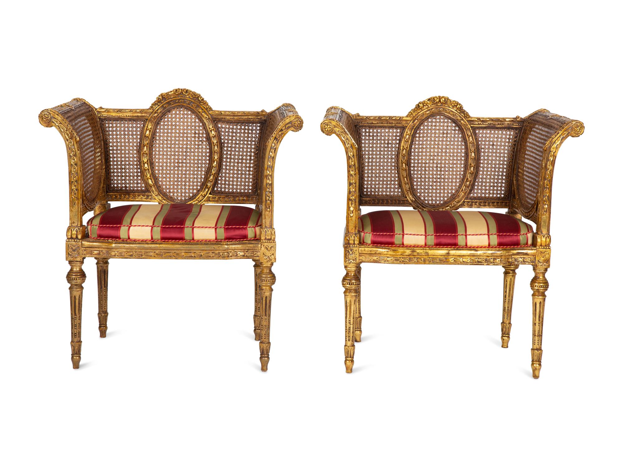 A Pair of Louis XVI Style Giltwood Cane-Back Benches