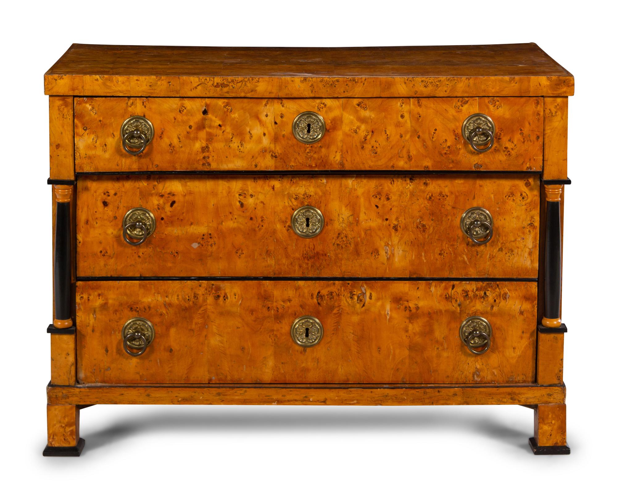 An Austrian or Northern European Parcel Ebonized Burlwood Commode