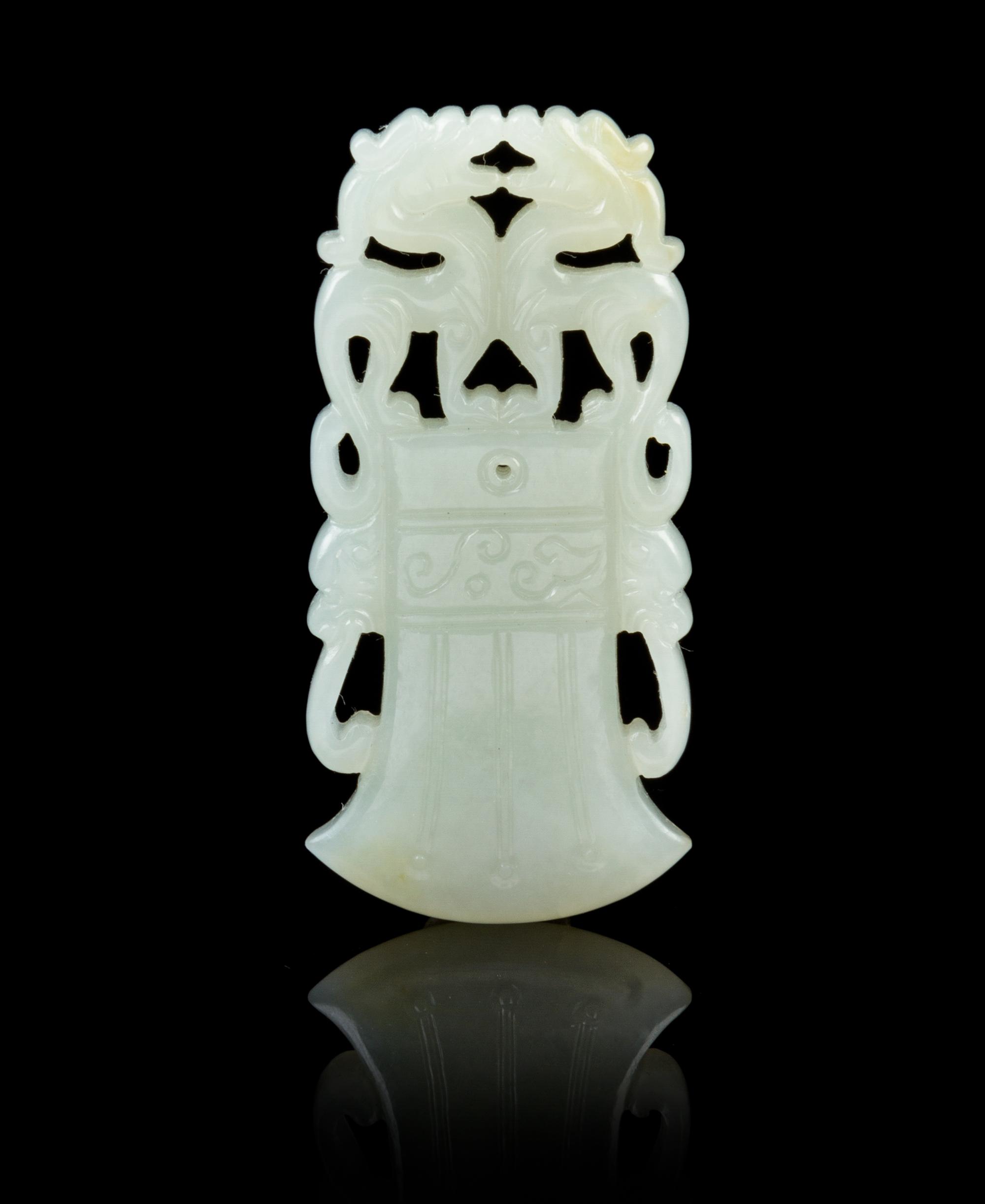 A Chinese Jade Axe-Form Pendant 18TH/19TH CENTURY Height 2 1/2 inches. — 18TH/19TH CENTURY