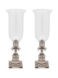 A Pair of Silvered-Metal and Glass Hurricane Candlesticks